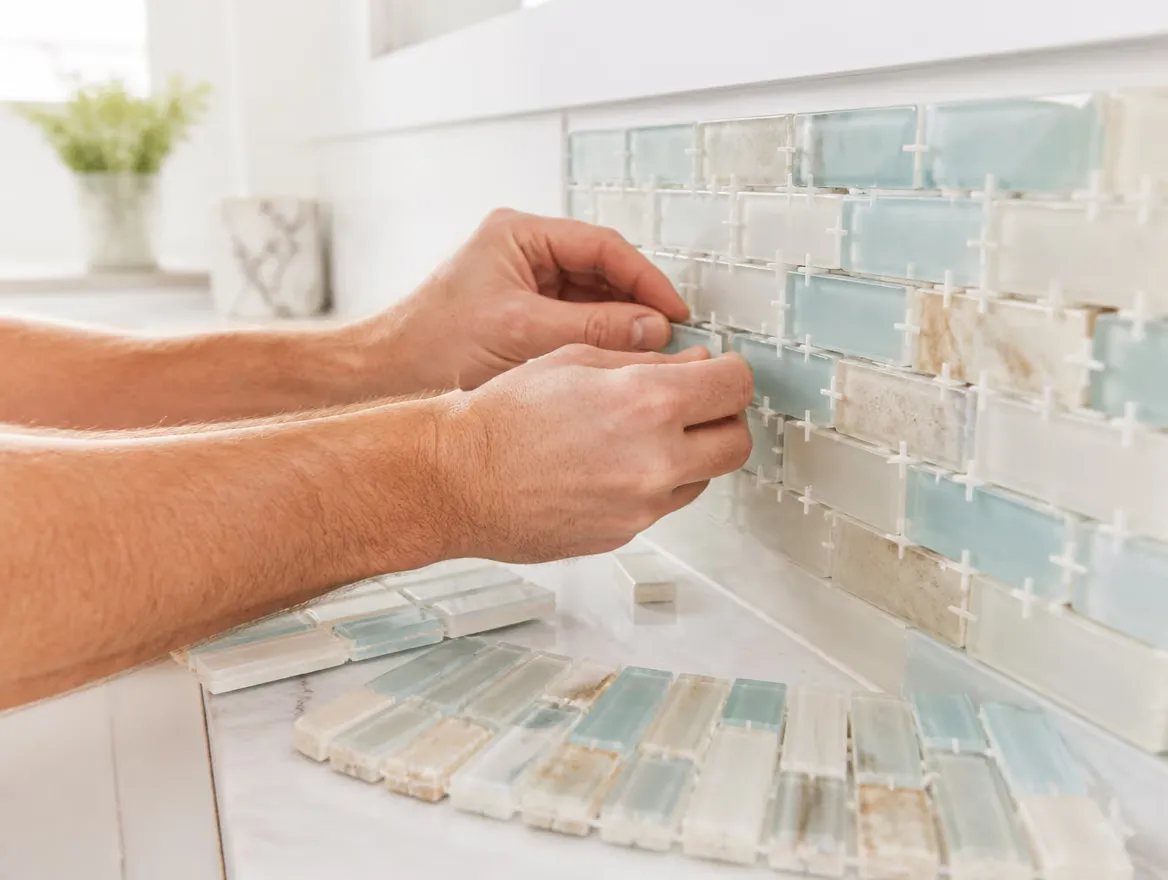 Glass and stone mosaic being set with spacers